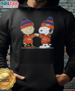 Charlie Brown and Snoopy fist bump in a cozy Denver Broncos football hoodie, showcasing team spirit and friendship.