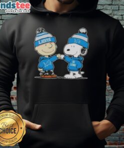 Charlie Brown fist bumps Snoopy in a Detroit Lions football hoodie, showcasing a fun Nice Peanuts themed design.