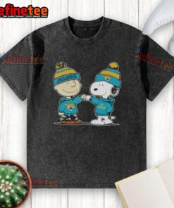 Charlie Brown and Snoopy fist bump on a washed t-shirt featuring Jacksonville Jaguars football design.