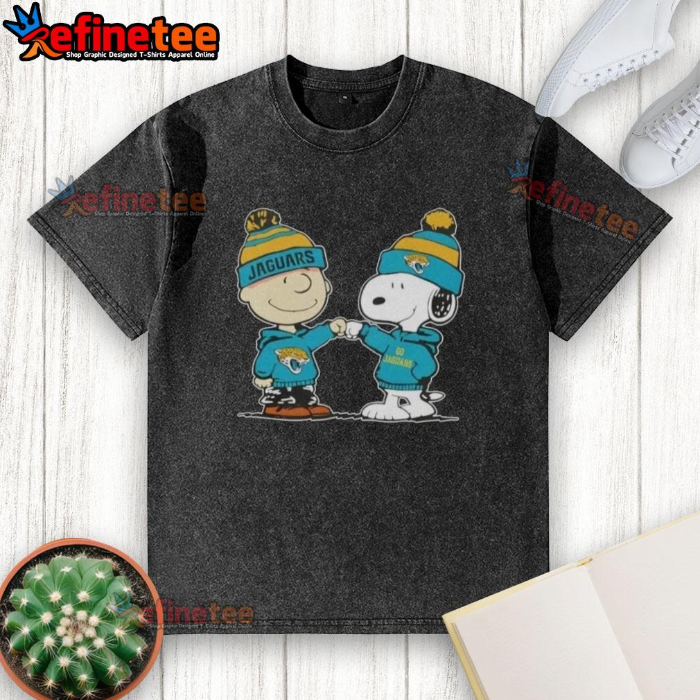 nice-peanuts-charlie-brown-fist-bump-snoopy-x-jacksonville-jaguars-football-washed-t-shirt Charlie Brown and Snoopy fist bump on a washed t-shirt featuring Jacksonville Jaguars football design.
