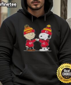 Alt Text: Charlie Brown and Snoopy fist bump in Kansas City Chiefs football hoodie, showcasing Nice Peanuts design.
