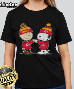 Alt Text: Nice Peanuts Charlie Brown fist bump with Snoopy, featuring Kansas City Chiefs logo on a ladies football tee.