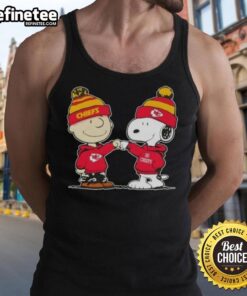 Charlie Brown and Snoopy fist bump in Kansas City Chiefs tank top, showcasing a fun football-themed design.