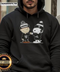 Alt Text: Charlie Brown and Snoopy fist bump in Las Vegas Raiders hoodie, showcasing a fun Nice Peanuts design.