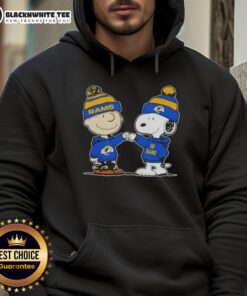 Charlie Brown and Snoopy fist bump in Los Angeles Rams football hoodie, celebrating team spirit and friendship.