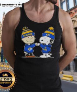 Charlie Brown and Snoopy fist bump in Los Angeles Rams tank top, celebrating football spirit and friendship.