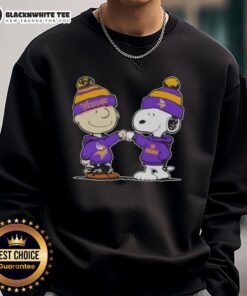 Alt Text: Charlie Brown and Snoopy fist bump in Minnesota Vikings sweatshirt, celebrating Peanuts fandom and football spirit.