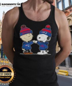 Charlie Brown fist bumping Snoopy on a New England Patriots football tank top featuring nice peanuts design.
