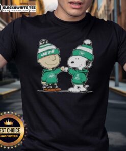 Nice Peanuts Charlie Brown and Snoopy fist bump on New York Jets football T-shirt design, perfect for fans.