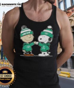 Charlie Brown and Snoopy fist bump in New York Jets football tank top, celebrating friendship and sports spirit.
