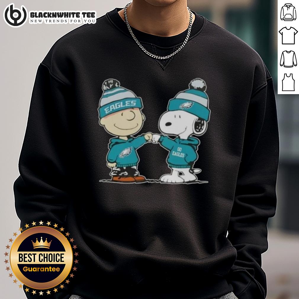 Nice Peanuts Charlie Brown Fist Bump Snoopy X Philadelphia Eagles Football Sweatshirt Alt Text: Charlie Brown and Snoopy fist bump on a Philadelphia Eagles football sweatshirt featuring Nice Peanuts design.