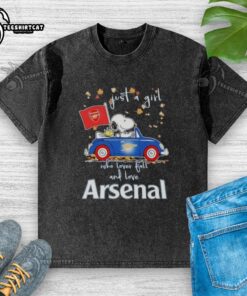 Alt Text: Snoopy driving a car on a washed t-shirt, celebrating fall and Arsenal FC, perfect for a girl who loves peanuts.