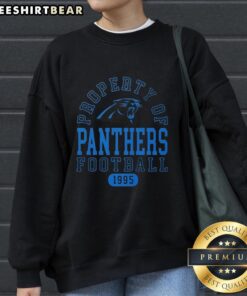 Carolina Panthers football sweatshirt, featuring a stylish design and logo, perfect for fans since 1995.