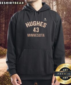 Quinn Hughes in a Minnesota 43 player hoodie, showcasing team spirit and style on the ice.