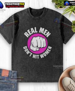 Nice Real Men Don't Hit Women washed t-shirt displayed on a hanger, promoting a message of respect and equality.