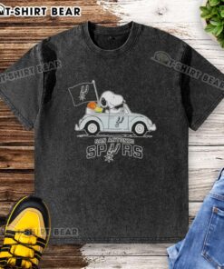 Snoopy driving a car in a San Antonio Spurs basketball themed washed t-shirt, showcasing fun sports apparel.
