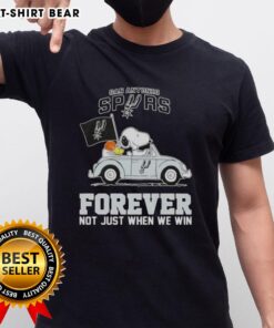 Snoopy driving a car on a San Antonio Spurs Forever T-shirt, celebrating team spirit beyond just winning.