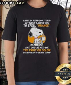 Snoopy holding coffee with a humorous quote on a ladies tee about spelling 'orange' - perfect for Peanuts fans.