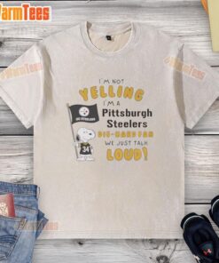 Alt Text: Pittsburgh Steelers die-hard fan wearing a washed t-shirt with Snoopy and text about being loud and passionate.