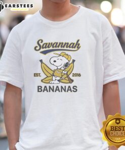 Alt Text: Snoopy lying on a banana wearing a Savannah Bananas outfit, showcasing the Est 2016 T-shirt design.