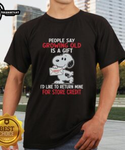 Alt Text: Funny Snoopy t-shirt with 'Growing Old Is A Gift I'd Like To Return Mine For Store Credit' text design.