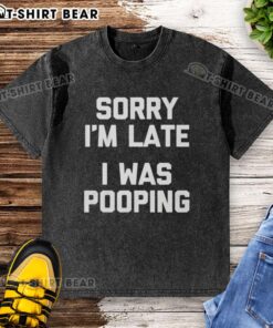 Funny 'Nice Sorry I'm Late I Was Pooping' washed t-shirt displayed on a hanger, perfect for humor lovers.