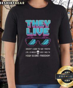8-bit 'They Live' glasses design on a ladies tee, featuring 'Insert Coin To See Truth' and 'High Score Freedom' graphics.
