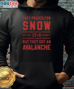 Group wearing 'Nice They Prayed For Snow' hoodies in Ann Arbor, MI, amid a snowy avalanche scene on Nov 29, 2025.