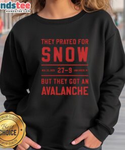 Cozy 'Nice They Prayed For Snow' sweatshirt in snowy Ann Arbor, MI, perfect for winter adventures and avalanche enthusiasts.