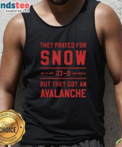 People in Ann Arbor, MI, wearing 'Nice They Prayed For Snow' tank tops during an unexpected avalanche on Nov 29, 2025.