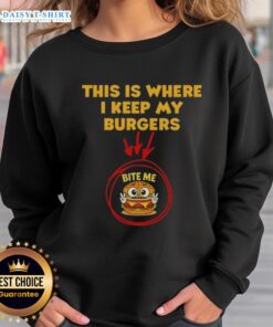 Cozy sweatshirt featuring 'This Is Where I Keep My Burgers' design, perfect for burger lovers and casual wear.