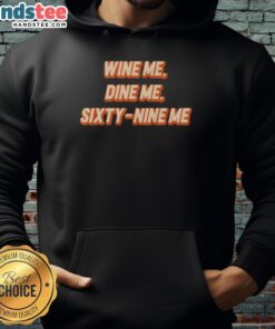 Cozy 'Nice Wine Me Dine Me Sixty Nine Me' hoodie, perfect for wine lovers and casual outings, showcasing fun, stylish design.
