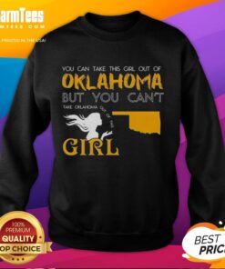 Girl wearing 'You Can Take This Girl Out Of Oklahoma' sweatshirt, showcasing Oklahoma pride and casual style.