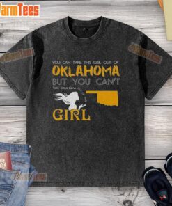 Girl wearing a 'You Can Take This Girl Out Of Oklahoma' washed t-shirt, showcasing her pride in Oklahoma culture.
