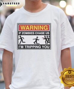 Original Warning If Zombies Chase Us I'M Tripping You T-Shirt featuring a humorous zombie-themed graphic design.