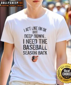 Alt Text: Official Baltimore Orioles I Act Like Im Ok But Deep Down T-Shirt featuring team logo and casual style.