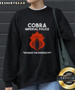 Alt Text: Official Cobra Imperial Police We Make The Evidence Fit sweatshirt featuring bold graphics and a comfortable design.