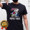 Official Colorado Avalanche Hockey Snoopy Perfect Smile T-Shirt featuring Snoopy with a joyful expression and team colors.