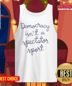 Official Democracy Is Not A Spectator Sport tank top worn by Nicolle Wallace, promoting civic engagement and political participation.
