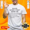 Official Funny Rules When I First Wake Up T-Shirt featuring humorous wake-up guidelines in a stylish design.