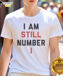 Alt Text: Official I Am Still Number One T-Shirt featuring bold text design on a stylish, comfortable fabric for trendsetters.