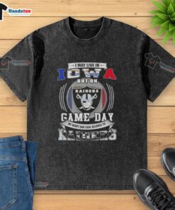 Alt Text: Washed t-shirt featuring 'I may live in Iowa but my heart belongs to Las Vegas Raiders football' design.