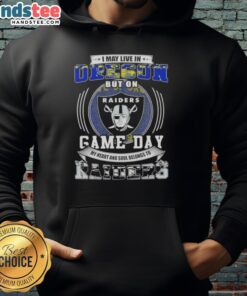 Fan wearing a Las Vegas Raiders hoodie, showcasing pride for the team despite living in Oregon on game day.