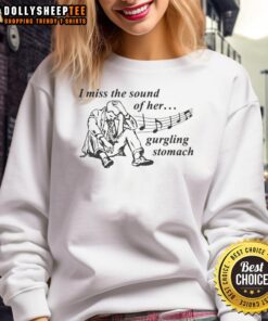 Official 'I Miss The Sound Of Her Gurgling Stomach' sweatshirt displayed on a hanger, perfect for casual style and humor.