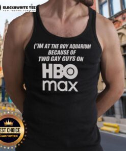 Two guys in tank tops at the aquarium, showcasing their 'I'm At The Boy' style from HBO Max in a vibrant setting.