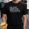 Official I'M Just Here For The Fights Plus Maybe They'll Kiss T-Shirt featuring bold text and a stylish design.