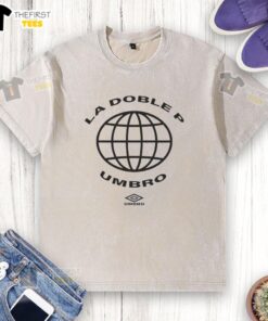 Official La Doble P Peso Pluma X Umbro washed t-shirt in light blue, featuring a stylish logo design for casual wear.