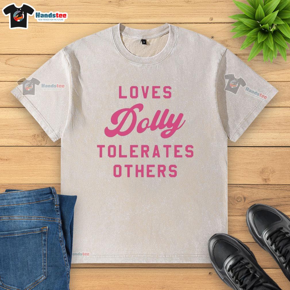 official-loves-dolly-tolerates-others-washed-t-shirt Alt Text: Official Loves Dolly Tolerates Others washed t-shirt featuring a fun graphic design on a casual, stylish shirt.
