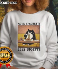 Alt Text: Black cat enjoying Italian food while wearing the More Spaghetti Less Upsetti sweatshirt, perfect for cat lovers.
