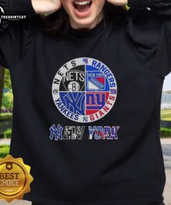 Alt Text: Official New York City sports sweatshirt featuring Nets, Rangers, Giants, and Yankees logos in a stylish design.